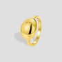 gold plated brass signet ring with a smooth raised oval dome