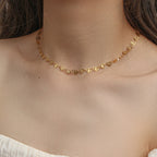 gold plated stainless steel open heart necklace worn at the collarbone