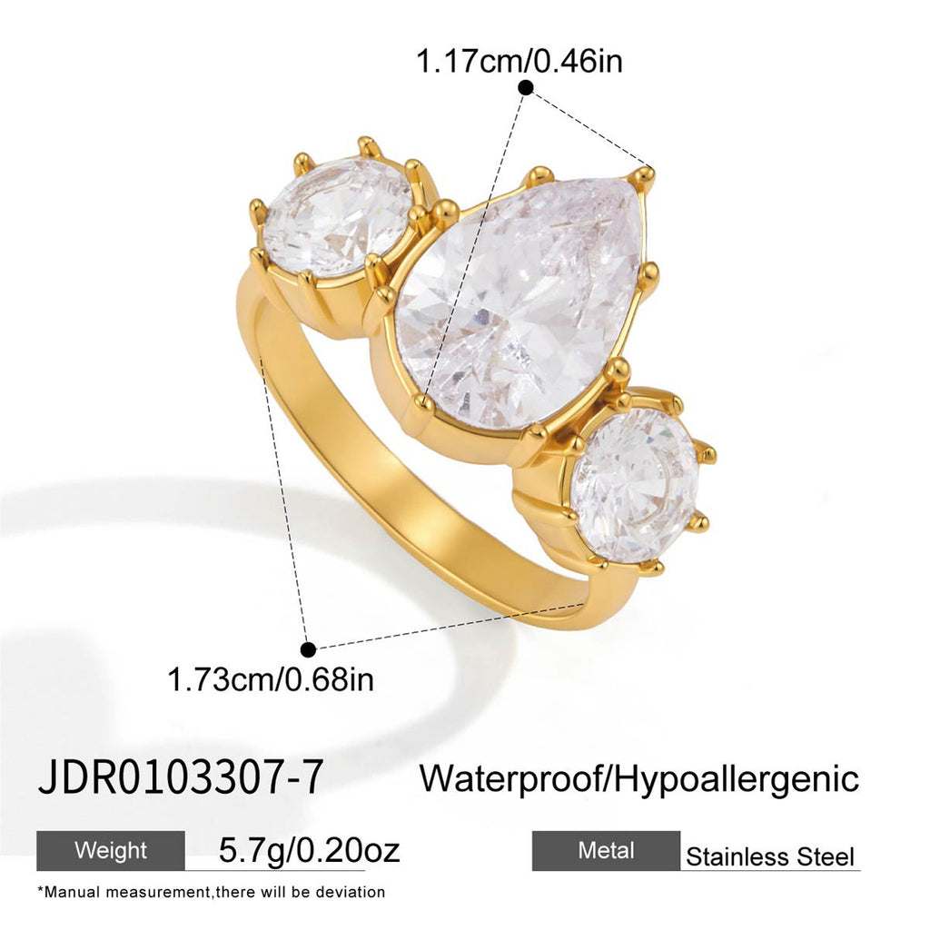 Three-stone ring with pear-shaped center and side accents