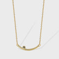 gold plated brass curved bar necklace with dark accent
