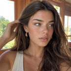 Gold plated U hoops worn by a model