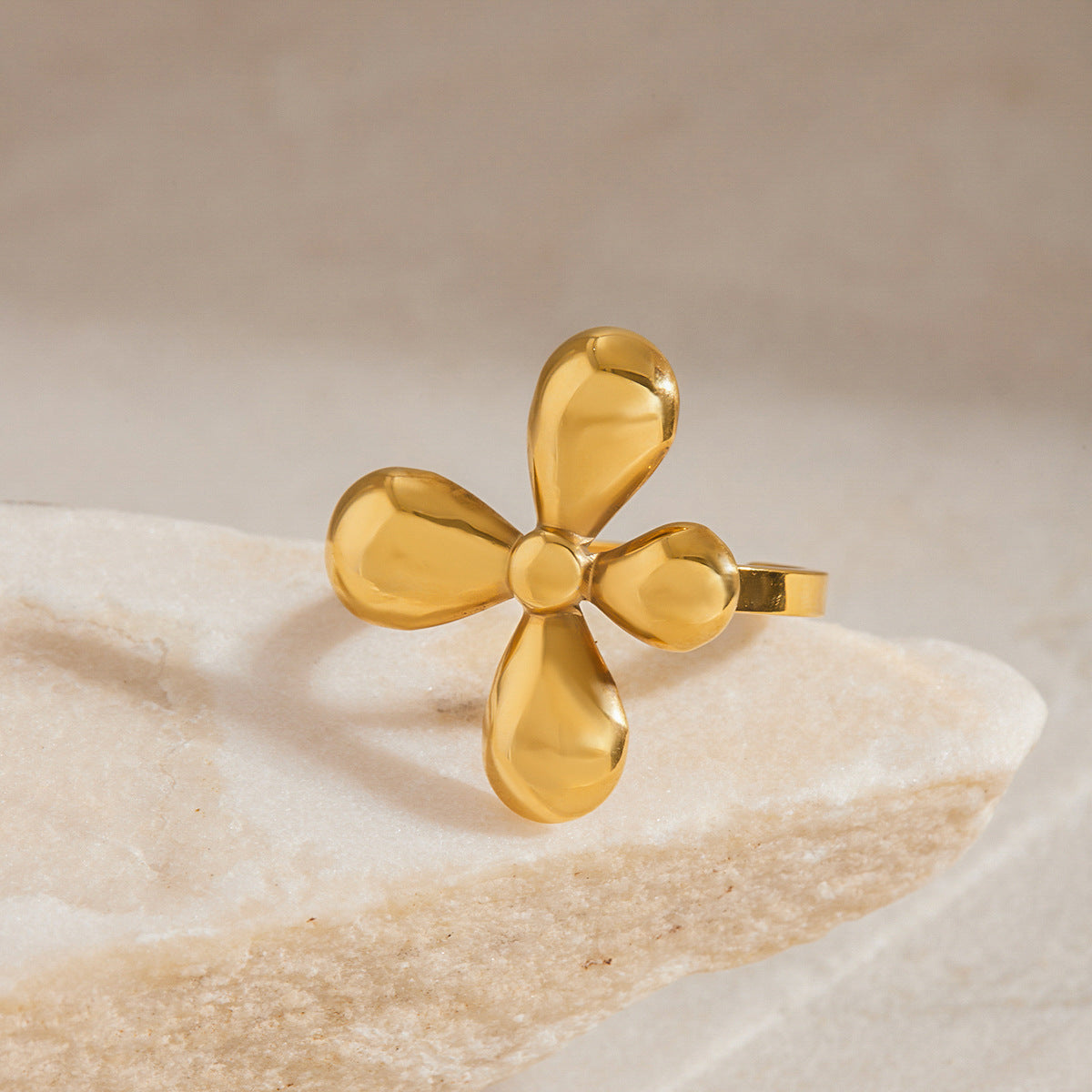 Raised flower ring on a pale stone display