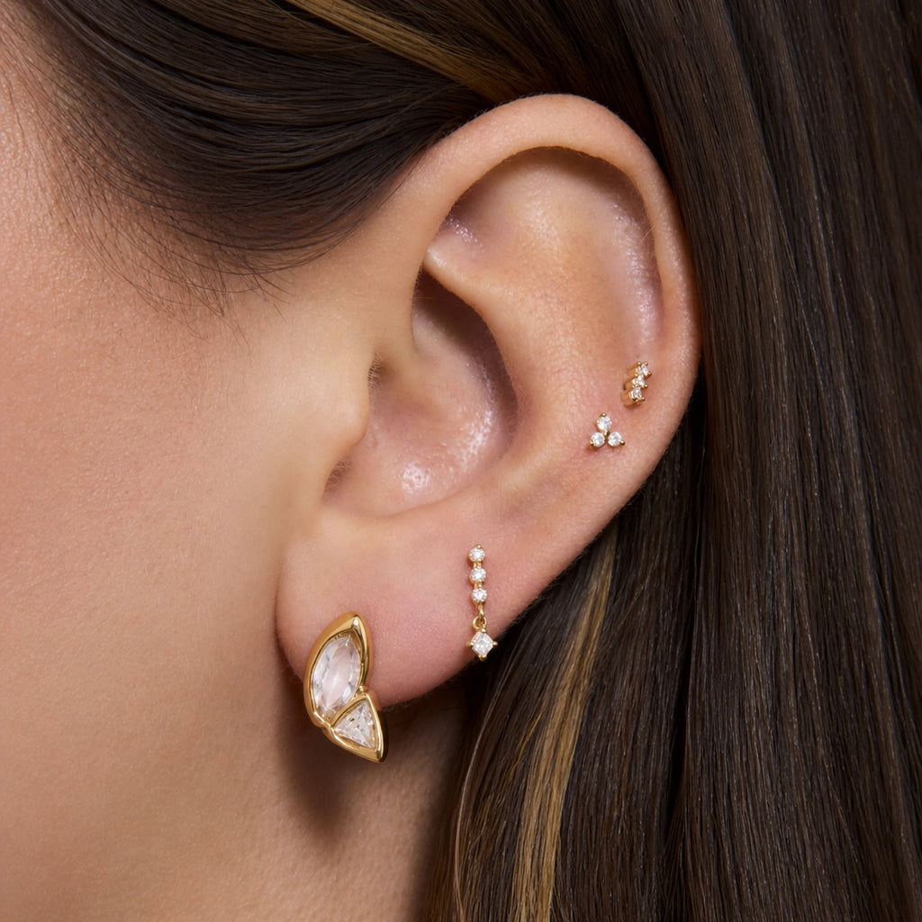 Slanted marquise and triangle stud shown on the lobe