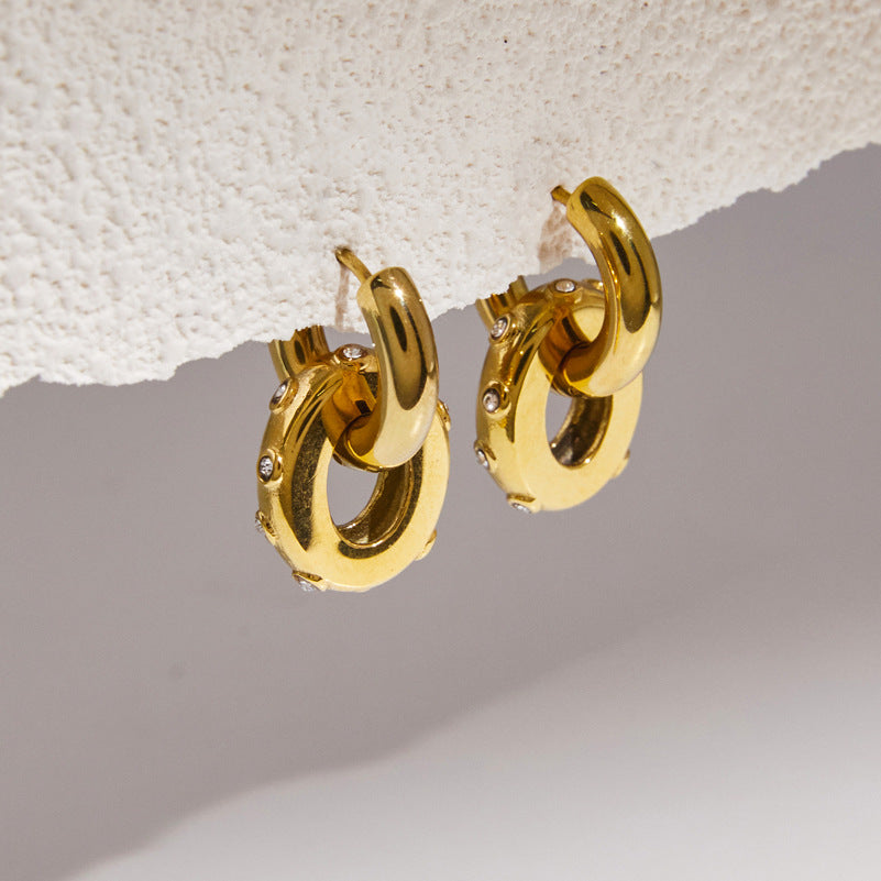 Gold tone hoops with oval ring drops and small rim stones