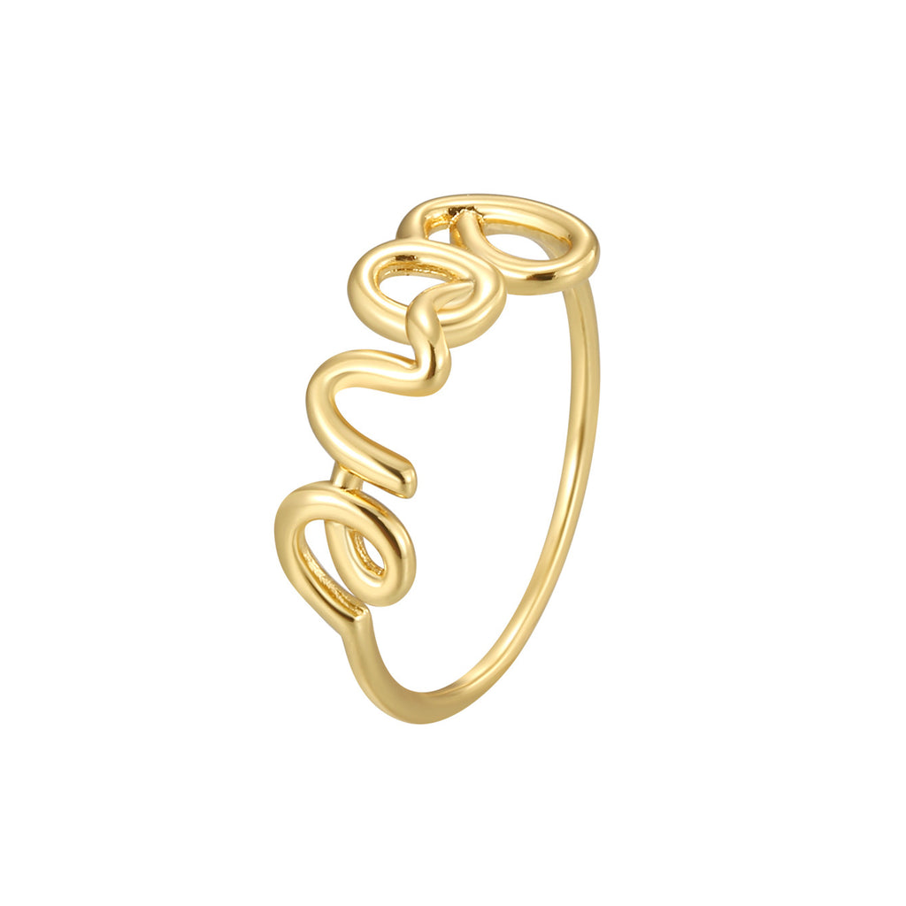 isolated gold plated LOVE wire script ring on white