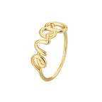isolated gold plated LOVE wire script ring on white