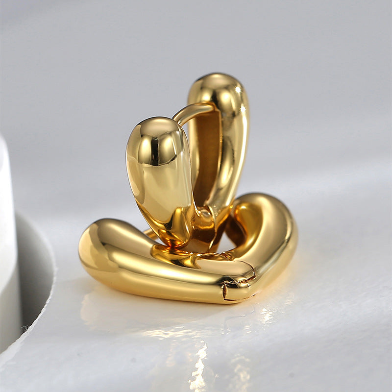 gold plated rounded heart huggie earrings with hinged closures