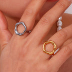 gold plated and silver open-center rings worn together on the hand