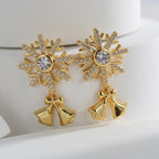 Gold plated clear-stone snowflake earrings with polished bell and bow drops