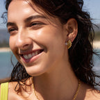 Zirconia fan stud earring worn outdoors