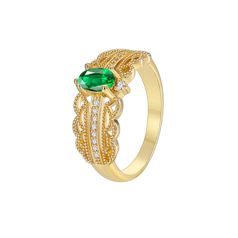detail of the oval green stone and clear pavé-style accents