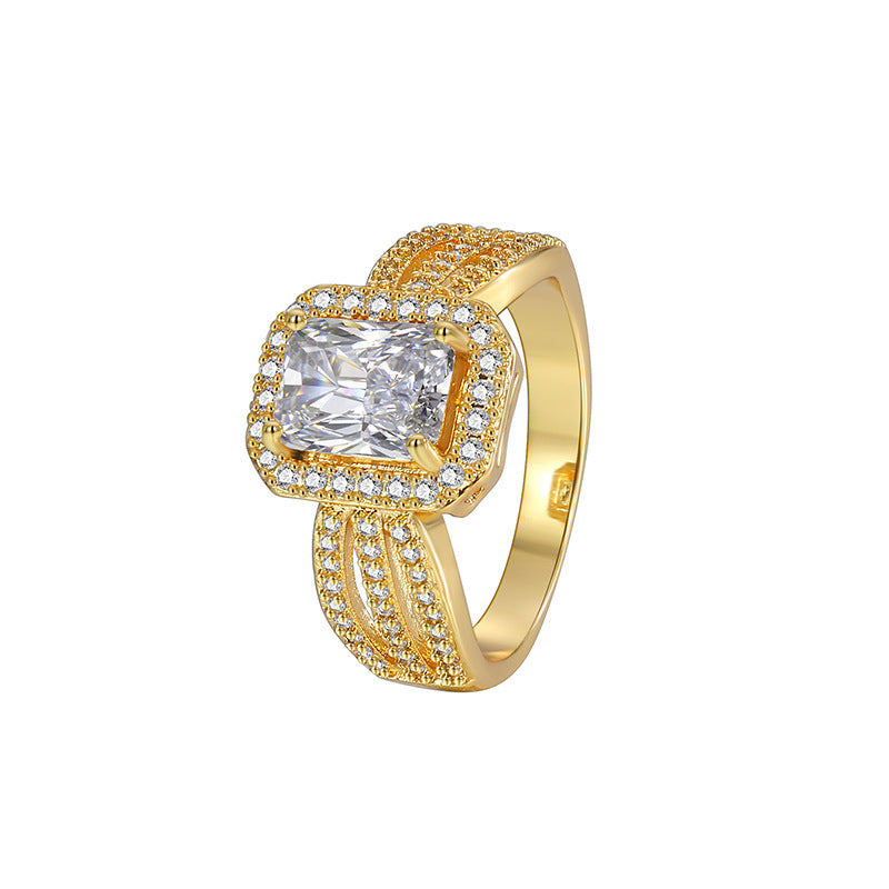 isolated gold plated square halo statement ring