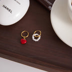 mismatched huggie pair with ivory bead loop and red heart drop
