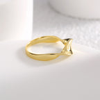 side view of asymmetric tapered band ring on white