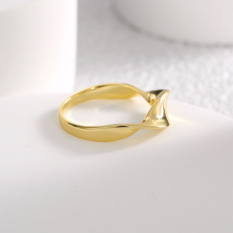 side view of asymmetric tapered band ring on white