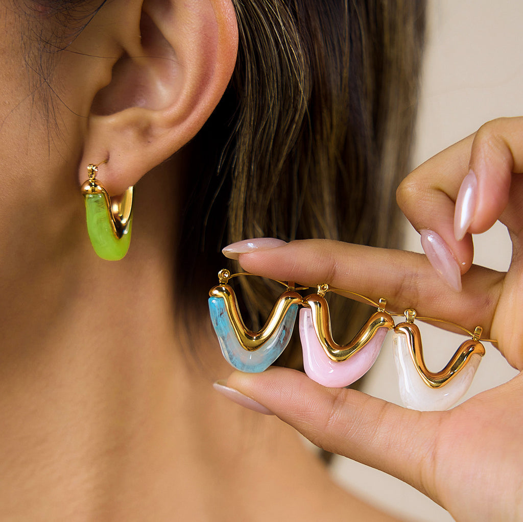 Green hoop worn while other resin colors are displayed