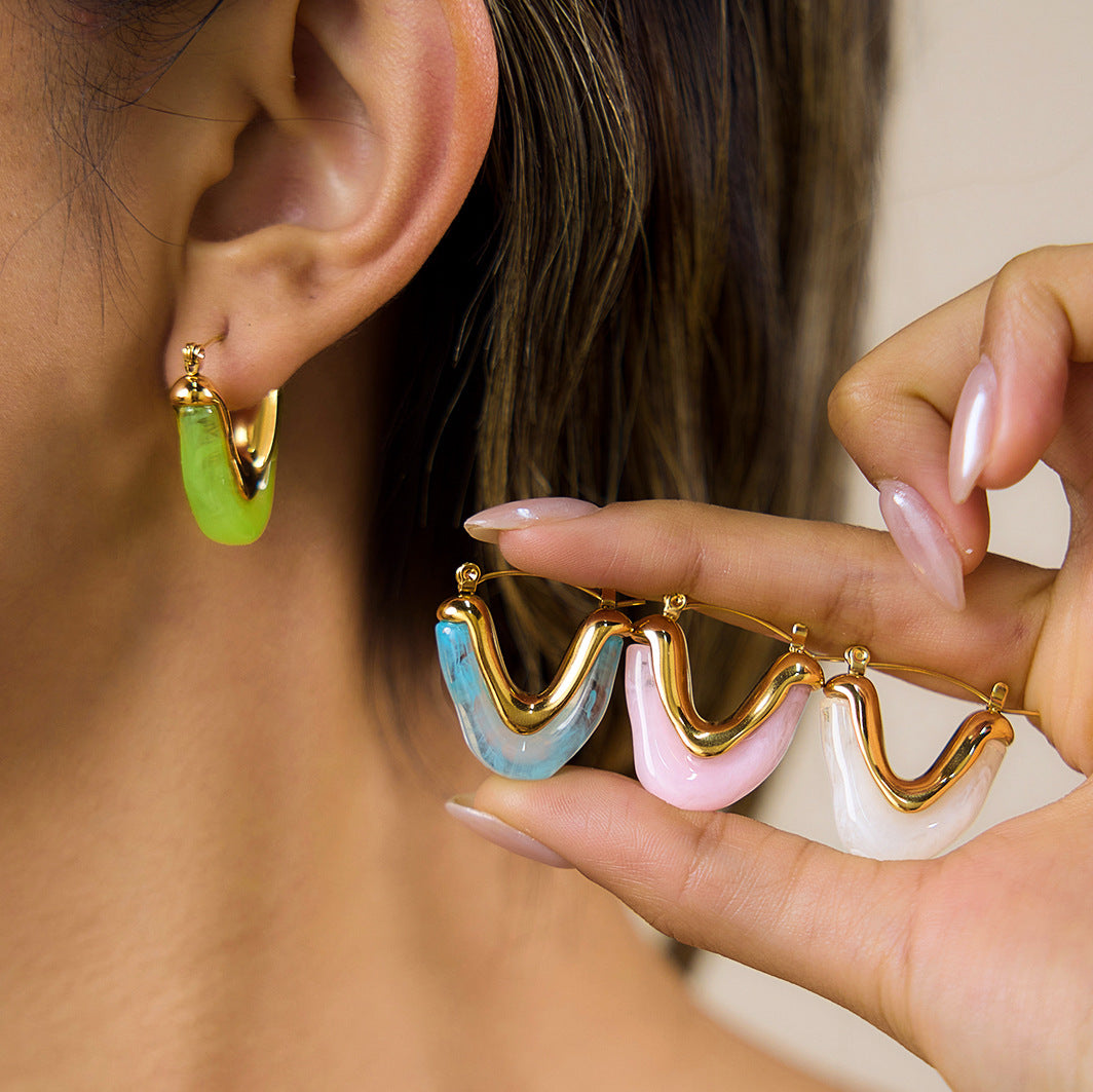 Green hoop worn while other resin colors are displayed