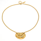 Rounded swirl pendant and linked chain on white