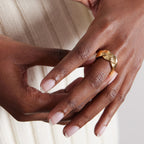 Textured braided ring worn on a hand