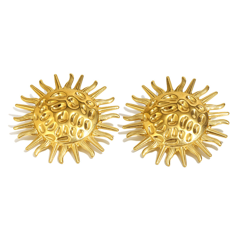 isolated front view of gold plated hammered sunburst stud earrings