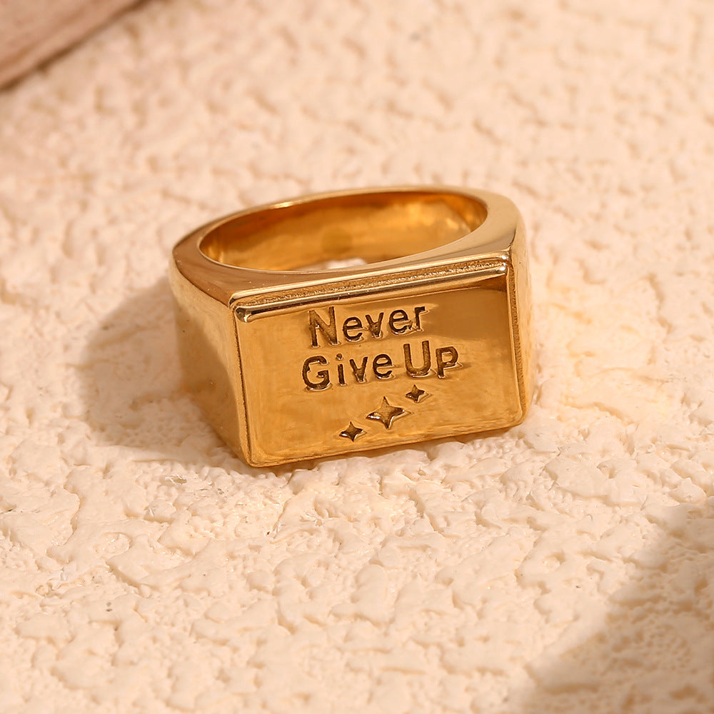 front view of rectangular Never Give Up signet ring