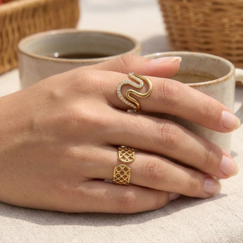 Wave and lattice rings worn together on hand