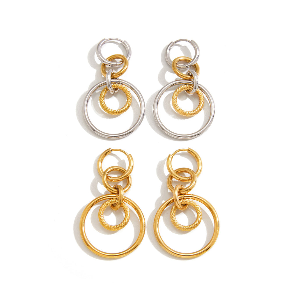 gold plated and two-tone multi-ring earring pairs on white