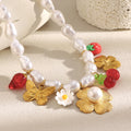 gold plated strawberry and butterfly imitation pearl charm necklace