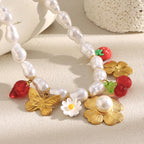 gold plated strawberry and butterfly imitation pearl charm necklace