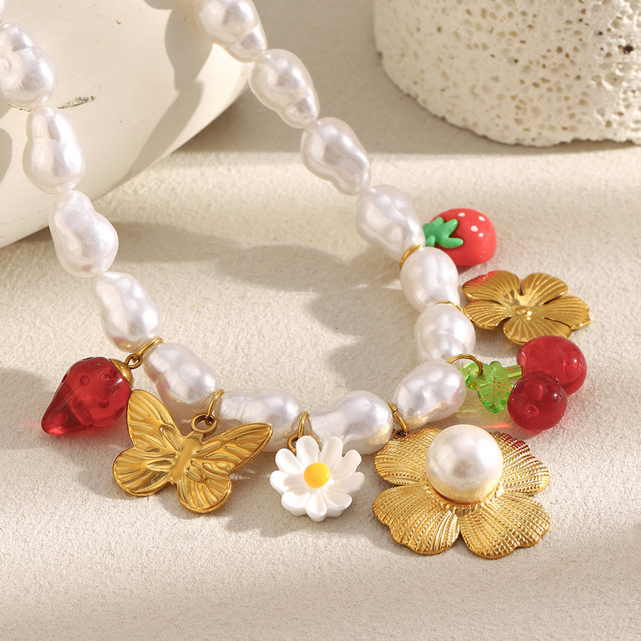 gold plated strawberry and butterfly imitation pearl charm necklace