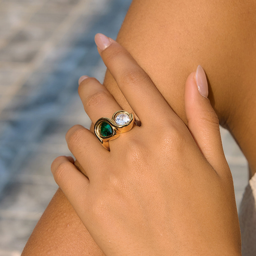 Two-stone gold tone ring viewed from another angle