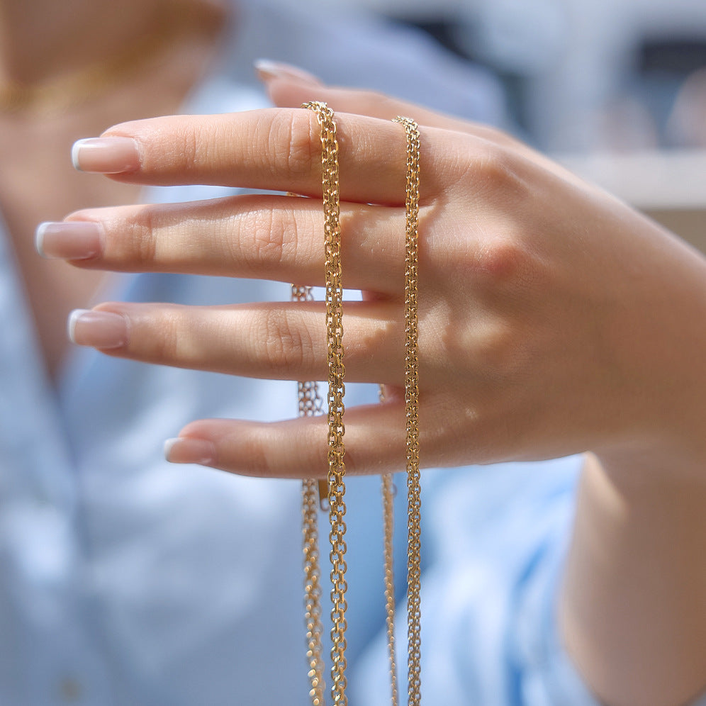 Chain link textures shown across a hand