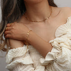 matching open heart necklace and bracelet set worn together