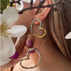 Mixed-Finish Open Heart Stainless Steel Hoop Earrings shown on model