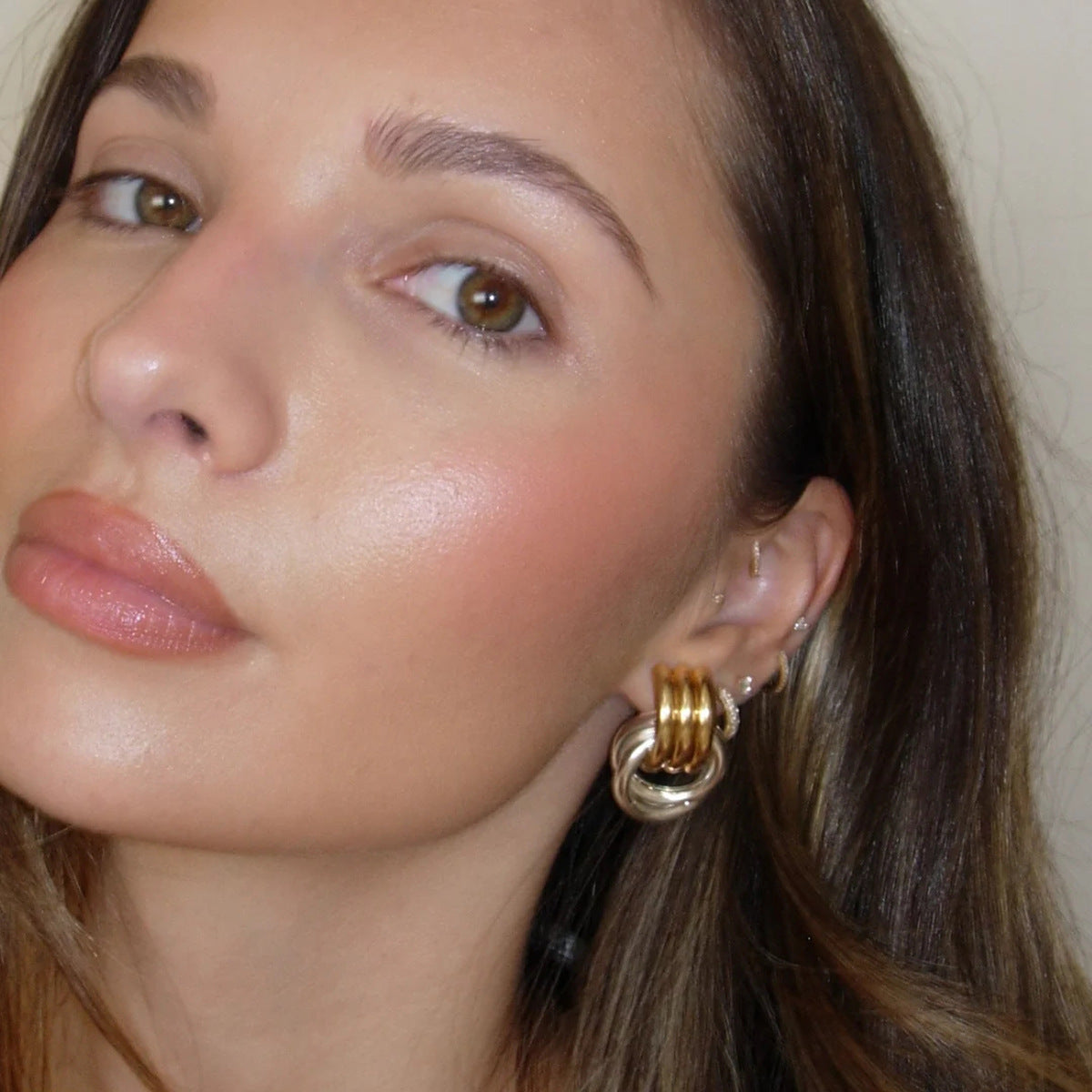 Gold Plated and Silver-Finish Stainless Steel Layered Loop Stud Earrings — detail view