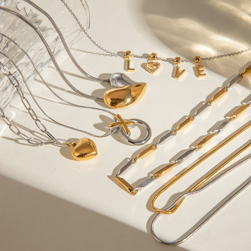 Mixed-Finish Stainless Steel Heart Necklace Collection styled product view