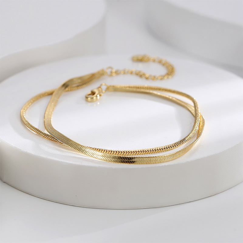 double-strand snake chain anklet on a white display