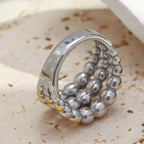 underside view of linked three-row stainless steel bead ring