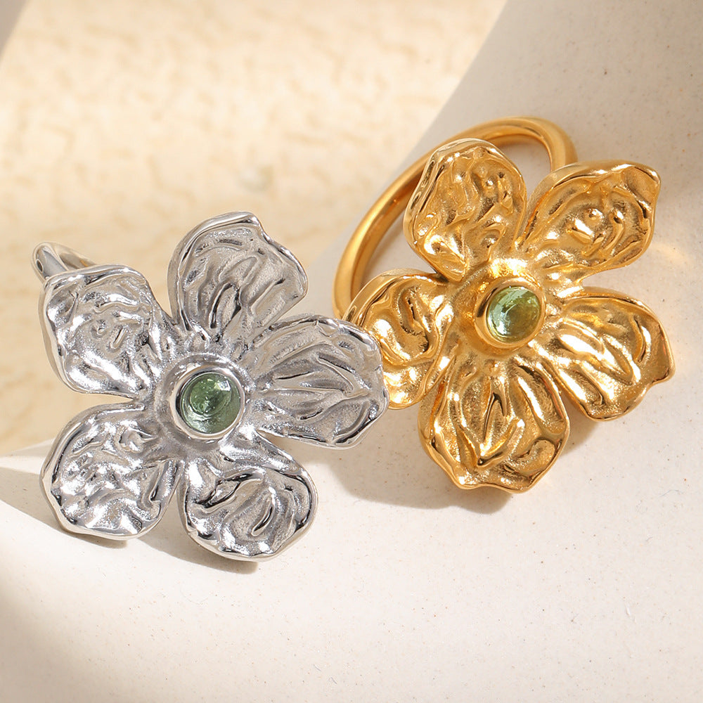 sculpted five-petal green stone rings in gold and silver finishes