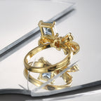rear angled view of raised blue-stone bow-knot ring