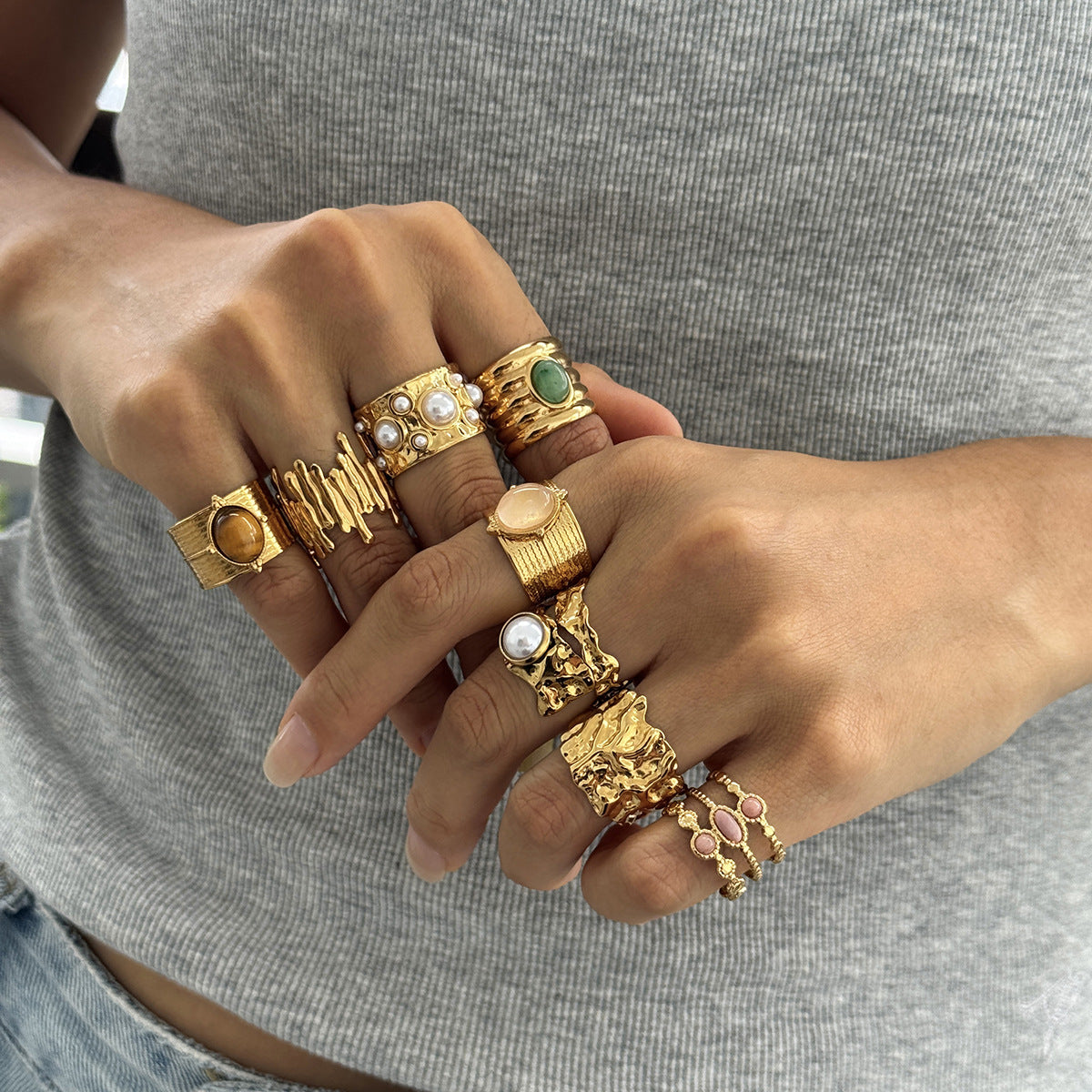 Textured and colored accent rings displayed on fingers