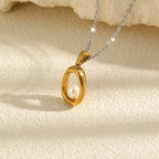 Gold Plated and Silver 316L Stainless Steel Oval Pearl Necklace — oval frame and pearl accent on stone