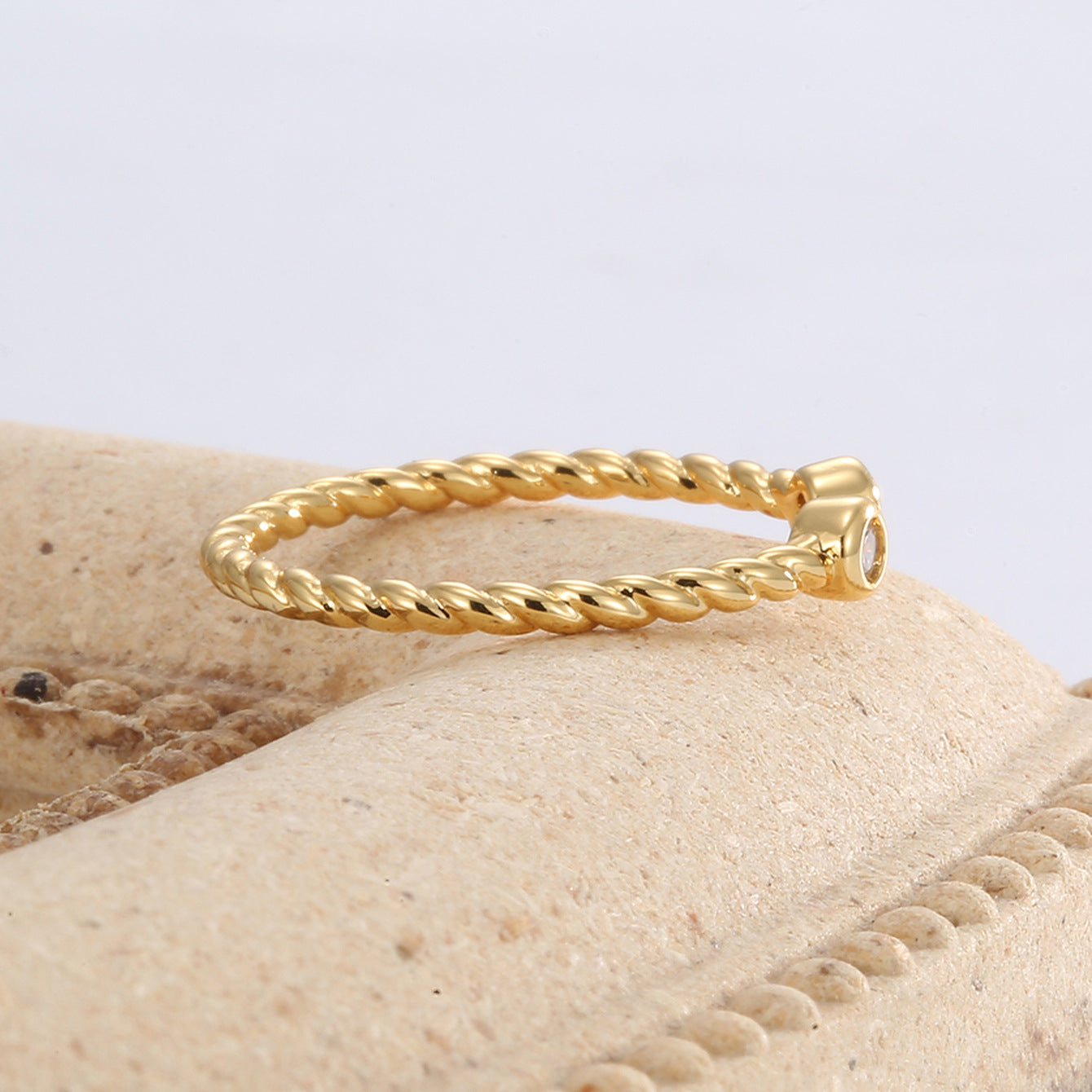 side view showing the slim rope texture and open ring setting