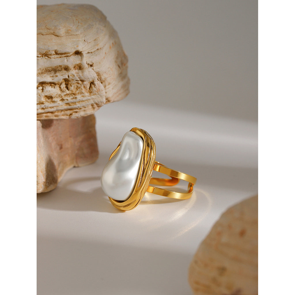 Gold plated irregular white inlay statement ring on stone props