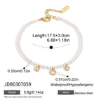 White beaded bracelet with three clear drops