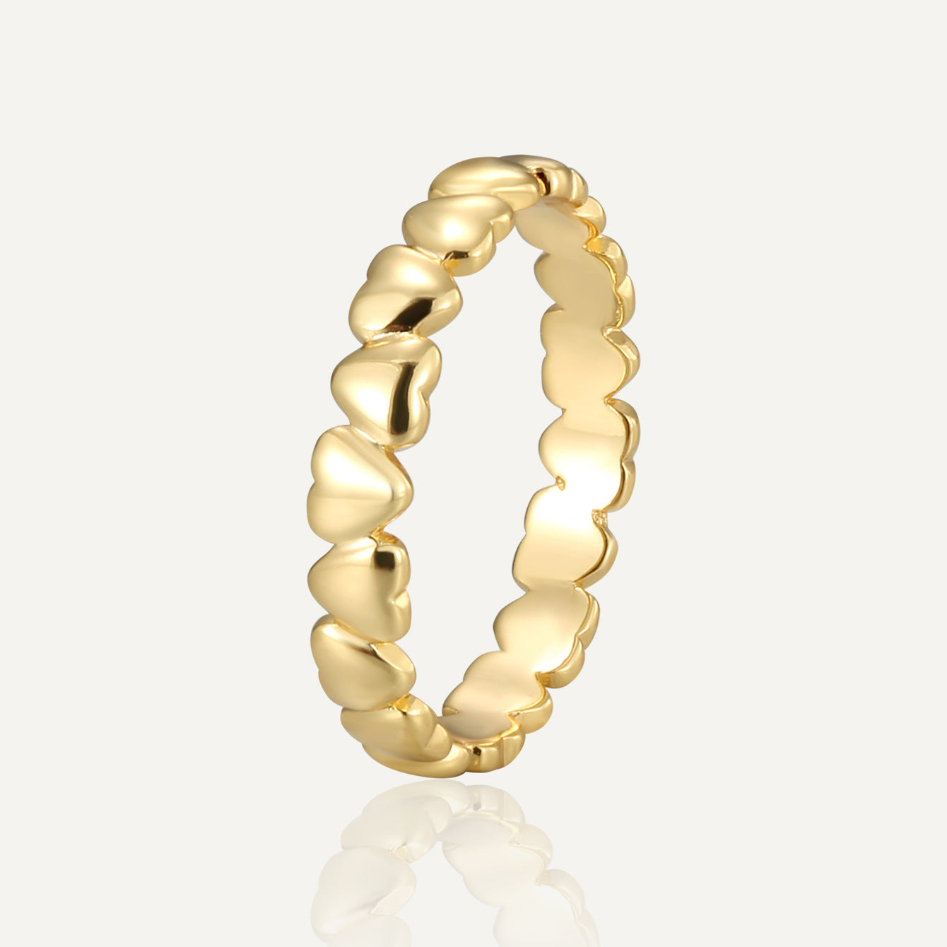 gold plated brass band ring with repeating polished hearts