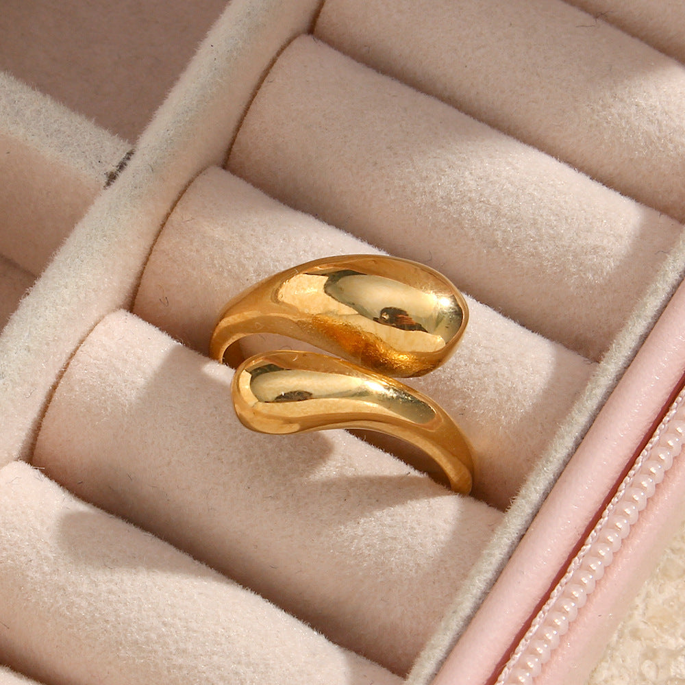 Gold-tone double teardrop ring in a jewelry case