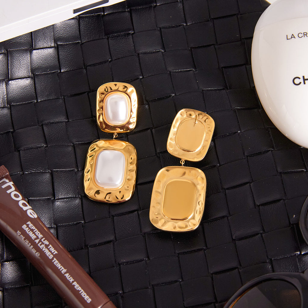 Gold Tone Pearl-Look Stainless Steel Double Drop Earrings — paired earrings on a neutral surface
