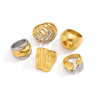Sculpted stainless steel ring assortment on white