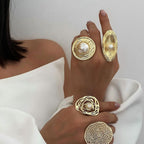Textured oval pearl-look statement ring styled with other rings